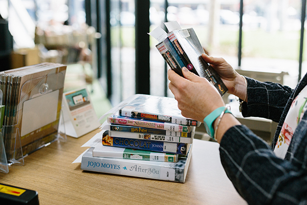 Woman borrowing books.